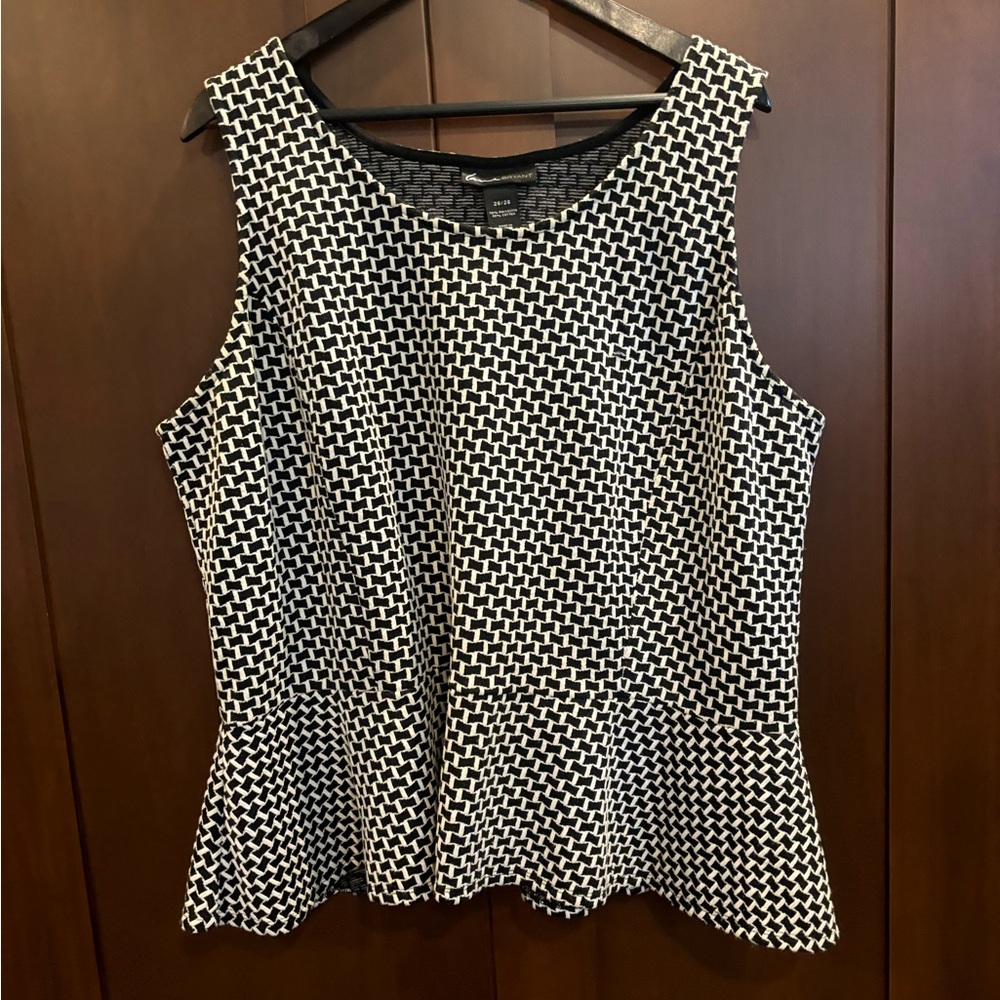 Stylish black and white peplum tank.